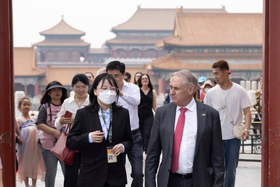 In this photo released by the Department of Foreign Affairs and Trade (DFAT), Australian Trade Minister Don Farrell visits the Forbidden City in Beijing on Friday, May 12, 2023. The trip was part of a joint effort by China and Australia to repair ties scarred by political rifts over the past decade. 