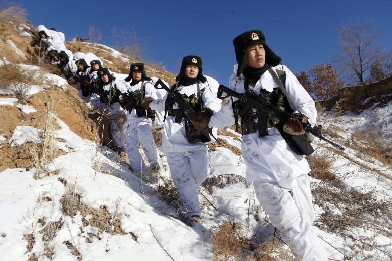 Chinese soldiers attend a winter training session in Heihe, northeast China's Heilongjiang province, January 28, 2015