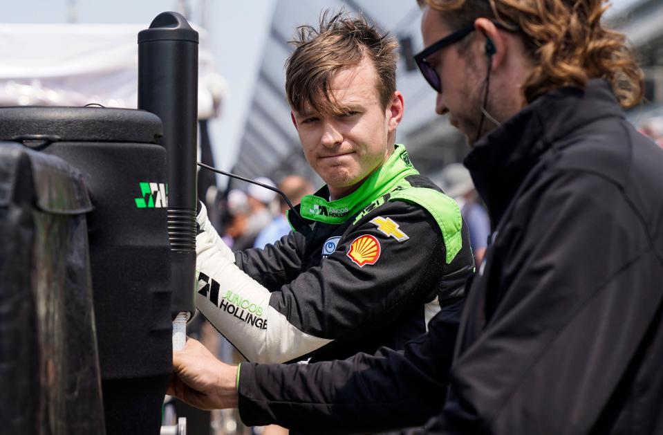 Juncos Hollinger Racing driver Callum Ilott (77) takes off his helmet during day two of Indianapolis 500 practice Wednesday, May 17, 2023, at Indianapolis Motor Speedway. 