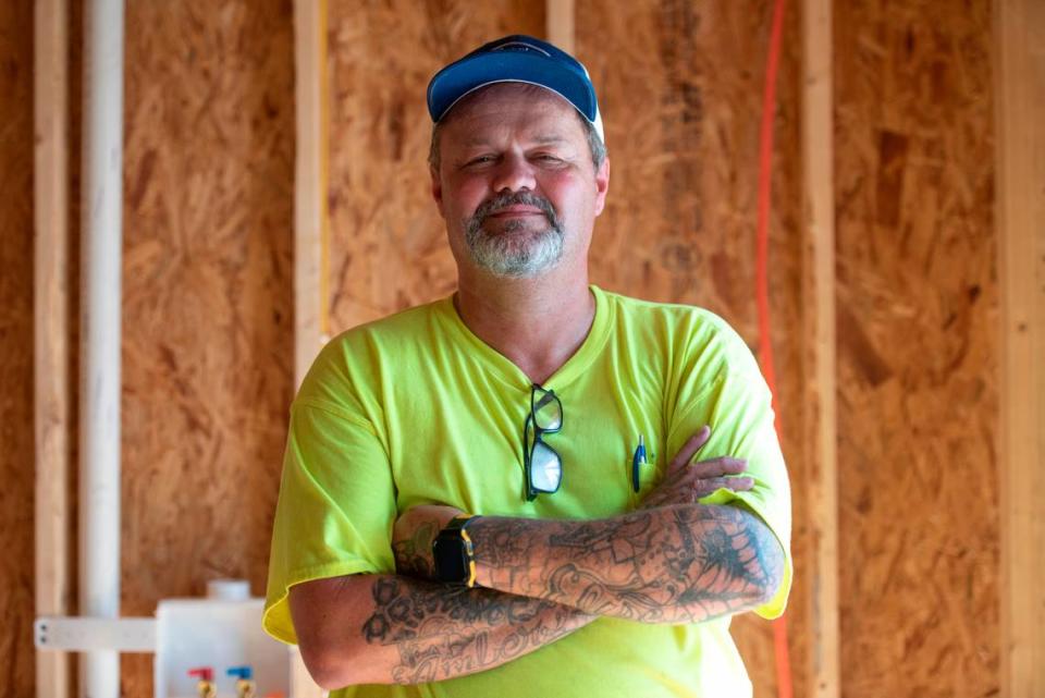 Shane McNeely, owner of Airlogy of Mississippi, poses for a portrait at a new construction home in Biloxi where his HVAC company was installing an air conditioning system on Thursday, Aug. 17, 2023.