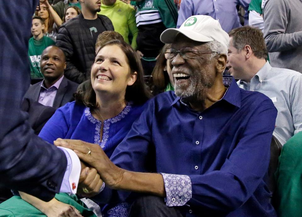 Boston Celtics legendary player Bill Russell is greeted at his seat before Game 1 of an NBA basketball second-round playoff series between the Boston Celtics and the Philadelphia 76ers, Monday, April 30, 2018, in Boston.