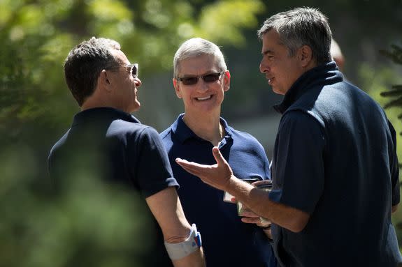 Disney CEO Bob Iger, Apple CEO Tim Cook and Eddy Cue, Apple senior vice president of internet software and services.