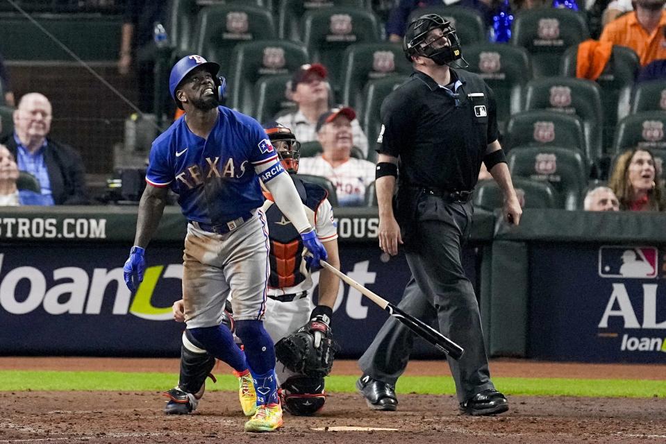 Texas Rangers' Adolis Garcia hits a home run during the eighth inning of Game 7 of the baseball AL Championship Series against the Houston Astros Monday, Oct. 23, 2023, in Houston. (AP Photo/Tony Gutierrez)