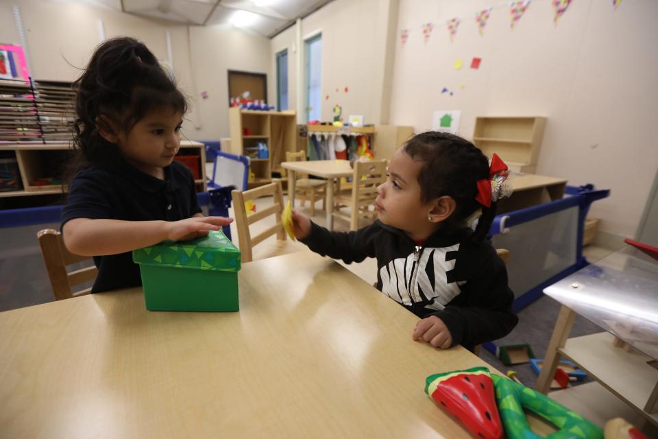 Dayaxielis Ramos and Ashely Martinez play with a box of triangles in preschool class at School 9.
