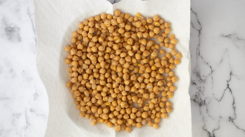 chickpeas draining on paper towels