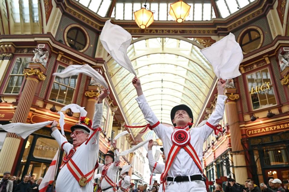 Ewell St Mary's Morris Men perform at London’s Leadenhall Market, for St George's Day, on Tuesday (AFP via Getty Images)