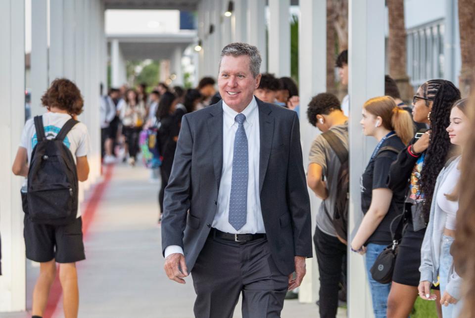 Palm Beach County schoola Superintendent Mike Burke greets students on their first day of school at Dr. Joaquin Garcia High School in August.