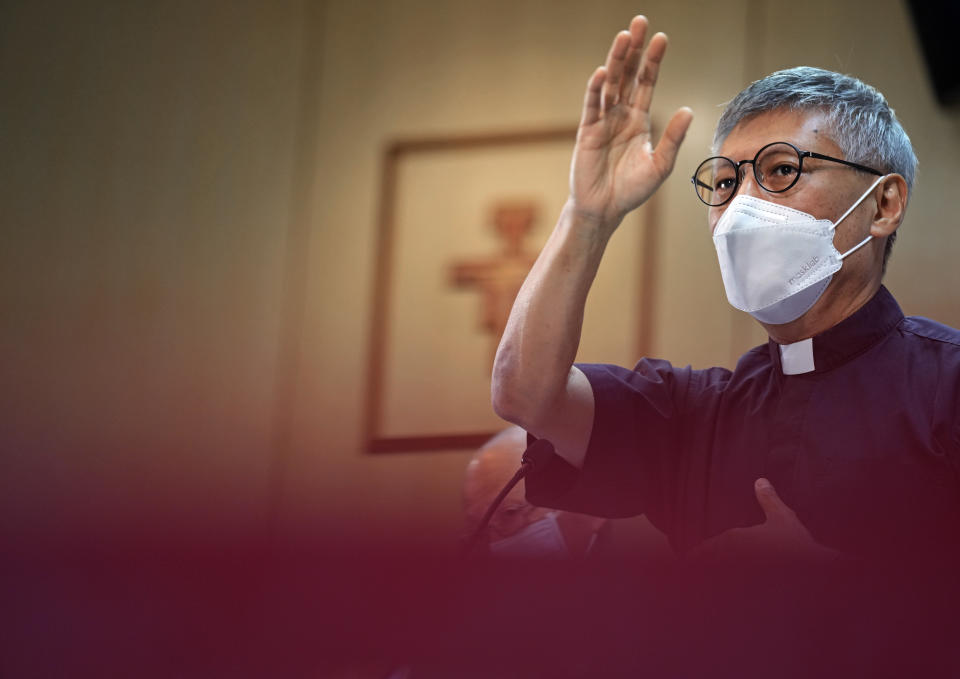 Stephen Chow Sau-yan prays after a press conference in Hong Kong Tuesday, May 18, 2021. Pope Francis on Monday named a new bishop for Hong Kong, tapping the head of his own Jesuit order in the region, the Rev. P. Stephen Chow Sau-Yan, for the politically sensitive position that has been vacant for two years. (AP Photo/Vincent Yu)