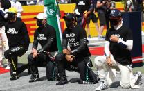 Drives take part in an anti-racism protest in support of the Black Lives matter movement prior to the Formula One Styrian Grand Prix race on July 12, 2020 in Spielberg, Austria. (Photo by Mark Thompson / various sources / AFP) (Photo by MARK THOMPSON/AFP via Getty Images)
