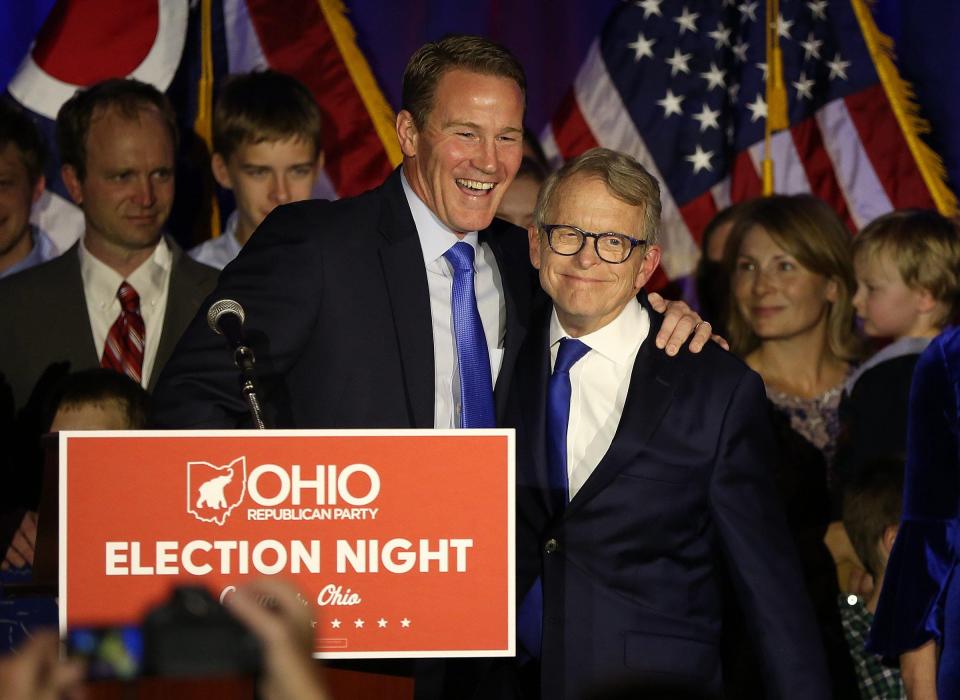 Jon Husted (left) and Mike DeWine celebrate the win for their Republican gubernatorial ticket at the GOP celebration at the Sheraton Hotel on Capitol Square on Nov. 6, 2018.