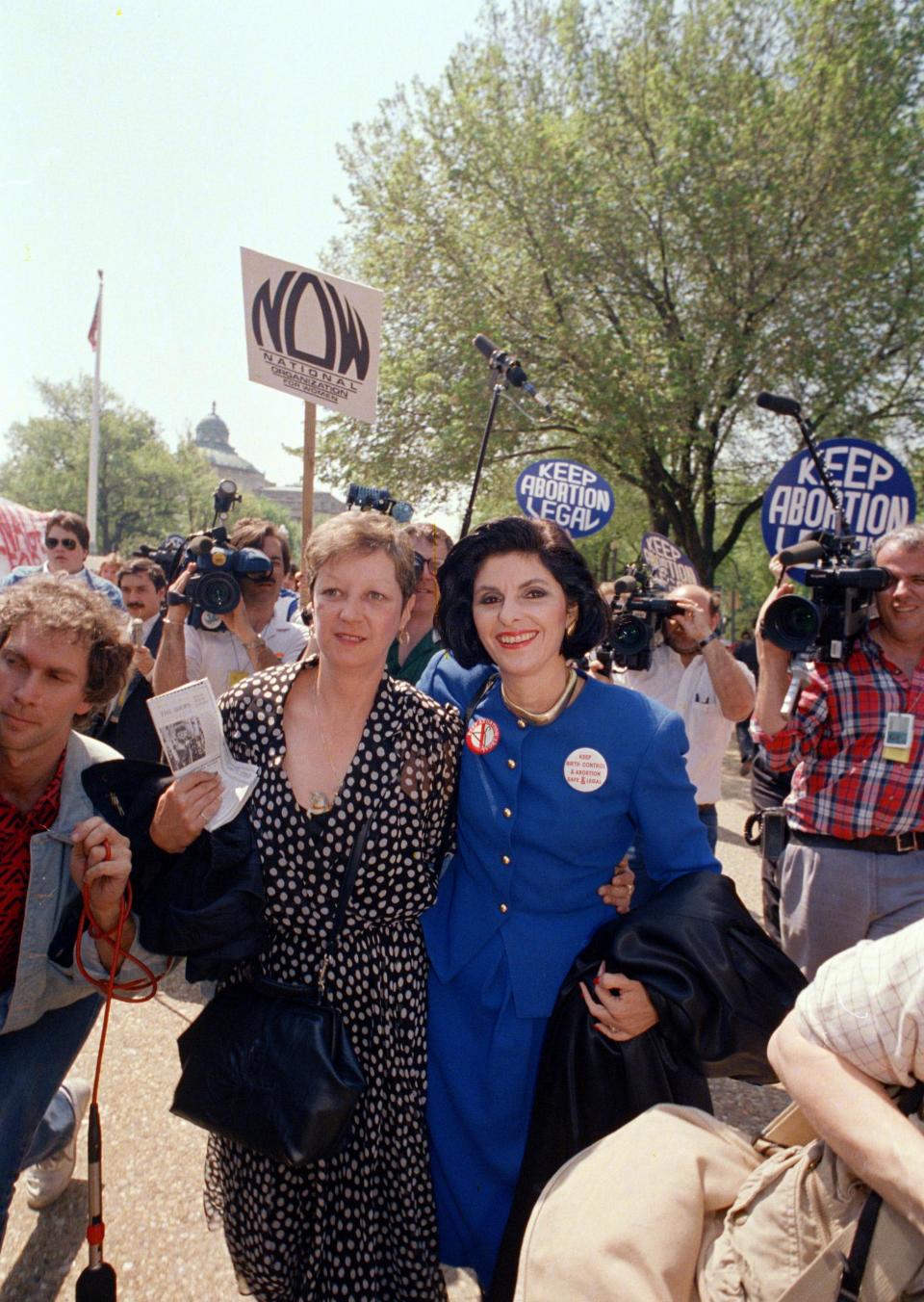 Jane Roe, left, a Texas cleaning woman whose pregnancy led to the 1973 landmark decision legalizing abortion, walks with her attorney Gloria Allred outside the Supreme Court Wednesday, April 27, 1989 in Washington. Roe, whose real name is Norma McCorvey, observed the high court as it heard arguments in Missouri case which could overturn the Roe vs. Wade decision. (AP Photo/J.Scott Applewhite)