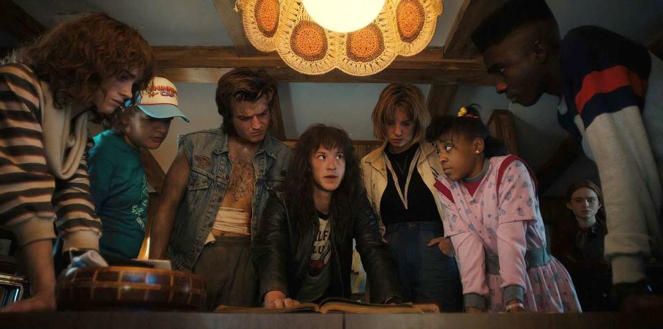 STRANGER THINGS. (L to R) Natalia Dyer as Nancy Wheeler, Gaten Matarazzo as Dustin Henderson, Joe Keery as Steve Harrington, Joseph Quinn as Eddie Munson, Maya Hawke as Robin Buckley, Priah Ferguson as Erica Sinclair, Sadie Sink as Max Mayfield, and Caleb McLaughlin as Lucas Sinclair in STRANGER THINGS. Cr. Courtesy of Netflix © 2022