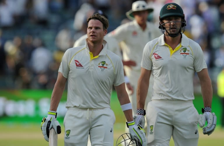 Australia captain Steve Smith (front-L) and teammate Shaun Marsh leave the field at the end of play on day two of the third Ashes Test in Perth on December 15, 2017