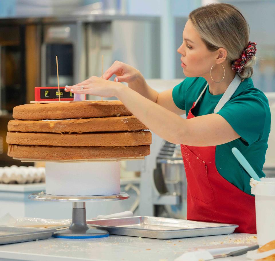Amanda Walker, a Coshocton native, will be competing on "The Big Bake" on the Food Network during an episode airing Monday. She led a team of three cake decorators from the Dallas area to create a cake with the theme of "Wreck the Halls" for Christmas.