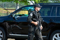 <p>A Capitol Hill Police officer walks past an automobile with the driver’s window damaged at the scene of a shooting in Alexandria, Va., Wednesday, June 14, 2017, where House Majority Whip Steve Scalise of La. was shot at a Congressional baseball practice. (Photo: Cliff Owen/AP) </p>