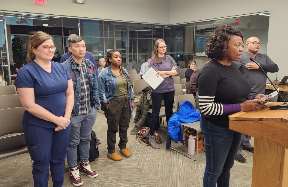 Alida Smith, joined by other members of Ending Racism in Bexley Schools, addresses the Bexley City Schools board during Wednesday's meeting, after a racist image was shown during morning announcements at Bexley Middle School early last month.