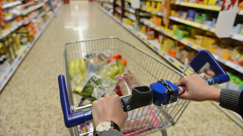 Aldi shopper pushing cart