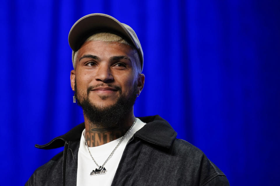 CORRECTS TO DEANDRE YEDLIN, INSTEAD OF KELLYN ACOSTA - DeAndre Yedlin smiles after being announced as a midfielder on the U.S. soccer team for the upcoming World Cup in Qatar, Wednesday, Nov. 9, 2022, in New York. (AP Photo/Julia Nikhinson)