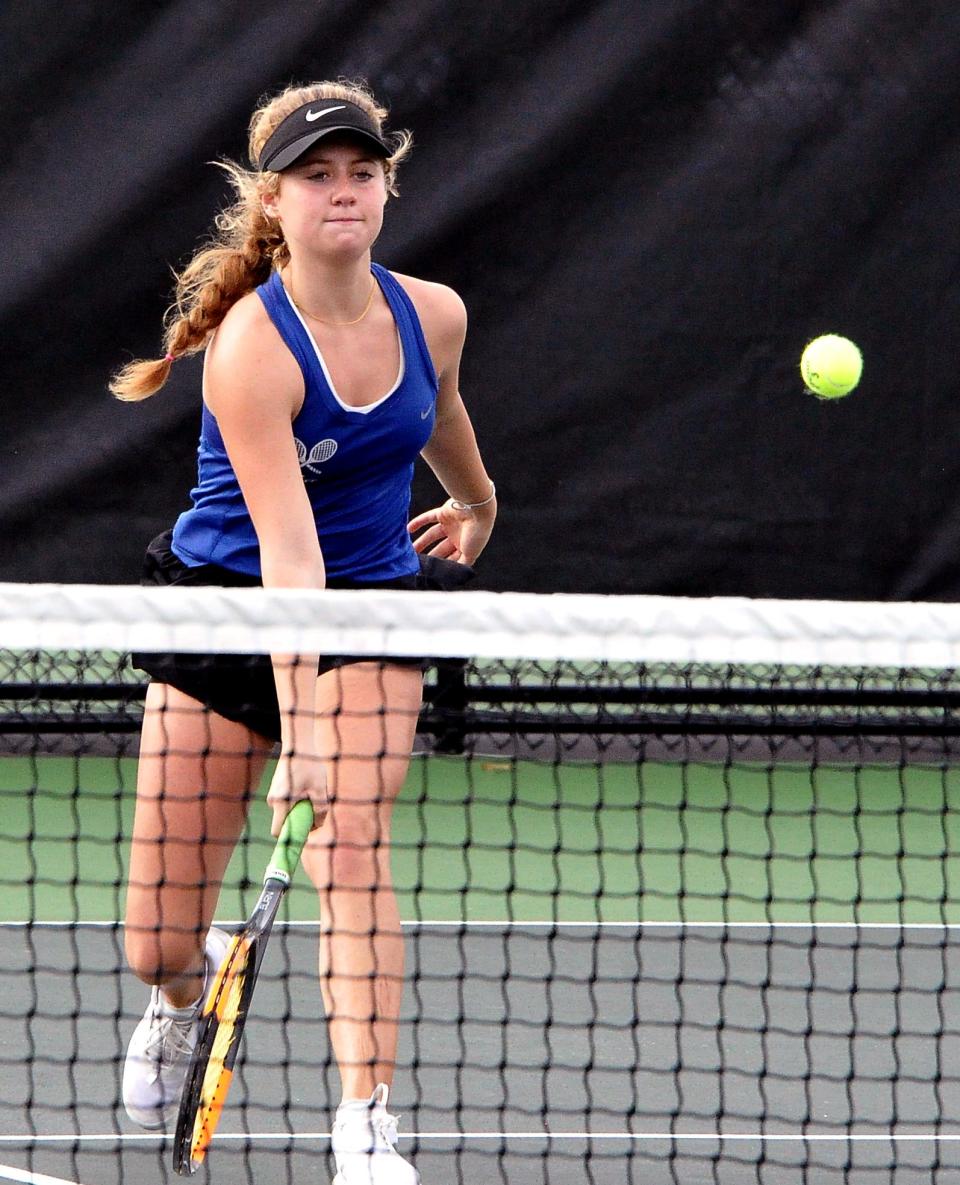 Wooster's Ava Mathur returns this low ball near the net in the OCC tournament.