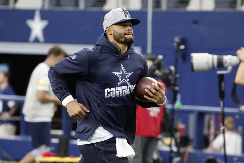 Dallas Cowboys quarterback Dak Prescott jogs off the field before a preseason game against the Houston Texans on Aug. 21.