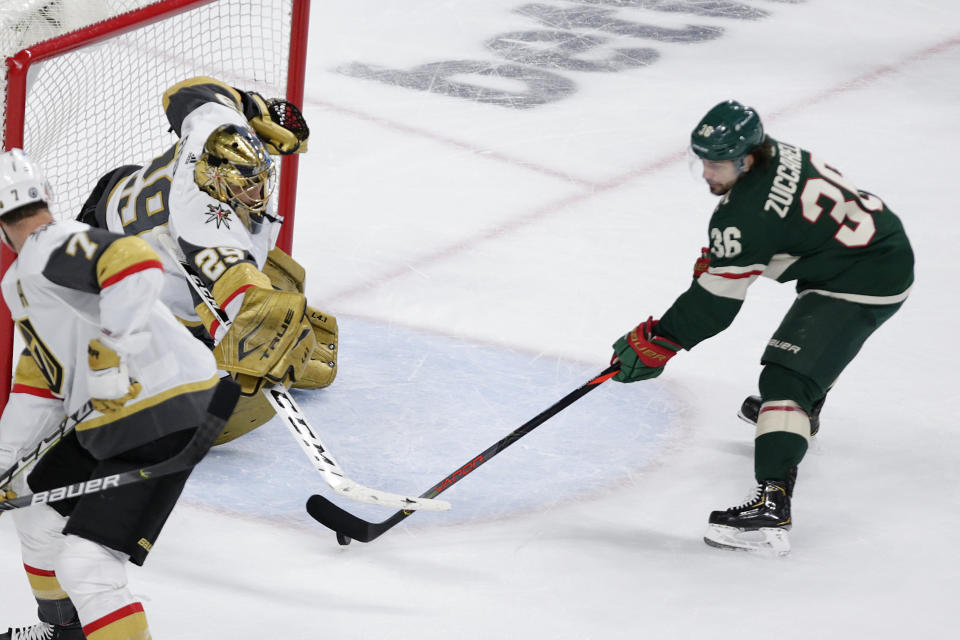 Vegas Golden Knights goaltender Marc-Andre Fleury (29) stops a shot by Minnesota Wild right wing Mats Zuccarello (36) during the first period in Game 6 of an NHL hockey Stanley Cup first-round playoff series Wednesday, May 26, 2021, in St. Paul, Minn. (AP Photo/Andy Clayton-King)