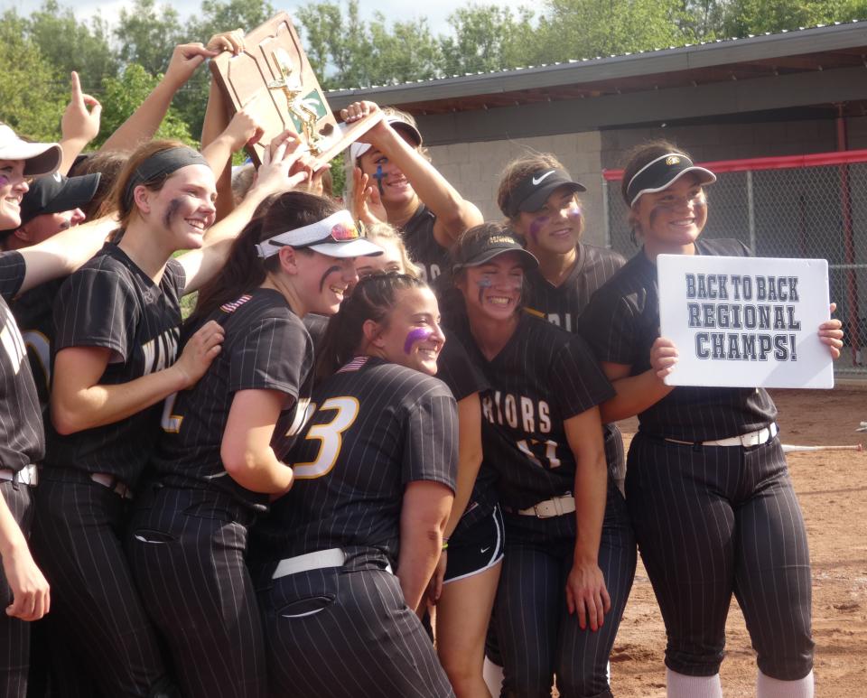 Watkins Memorial celebrates Saturday winning a second consecutive Division I regional title. The Warriors beat Lancaster 3-1 at Centerburg.