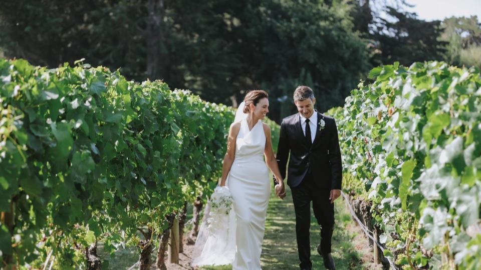 The happy couple took a stroll through the vineyard. Felicity Jean Photography.