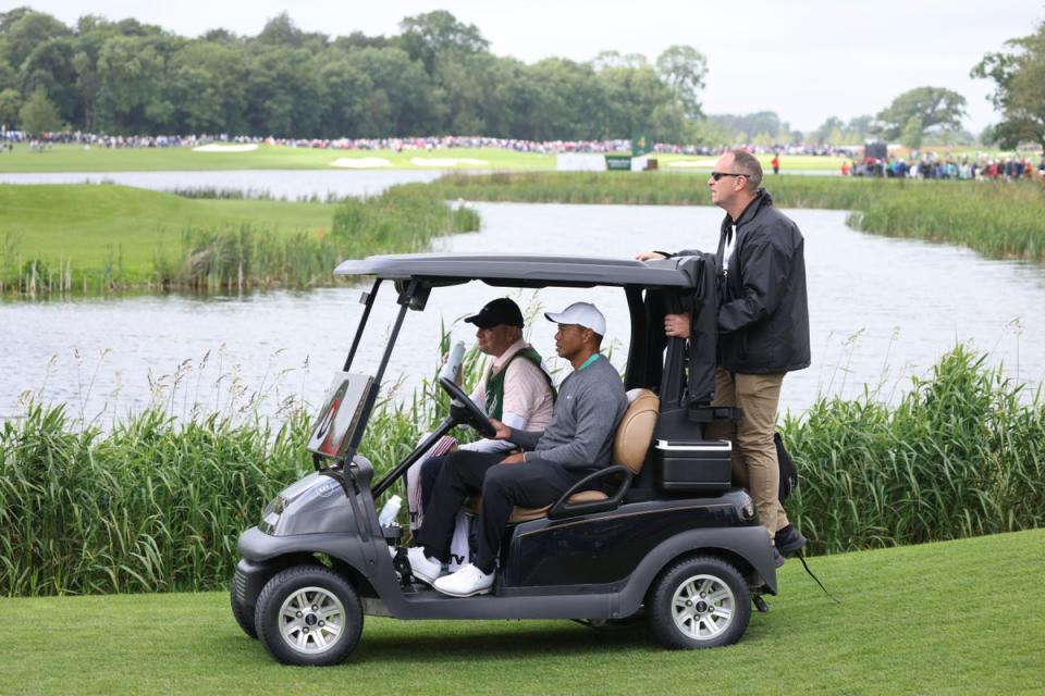 Tiger Woods uses a buggy to make his way along the fairway on the fifth hole during the JP McManus Pro-Am (Peter Morrison/AP) (AP)