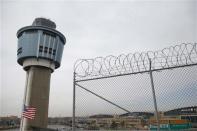 An air traffic control tower is seen at the central terminal of LaGuardia Airport in the Queens borough of New York April 8, 2014. REUTERS/Shannon Stapleton