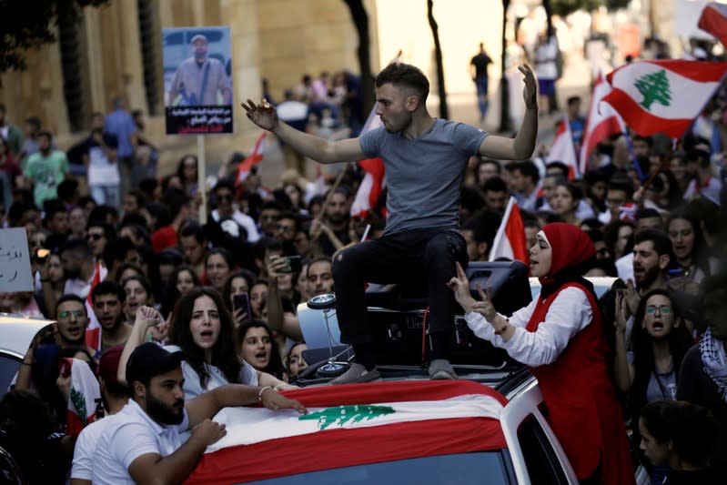 Protesters chant slogans as they march at a demonstration organised by students during ongoing anti-government protests in Beirut