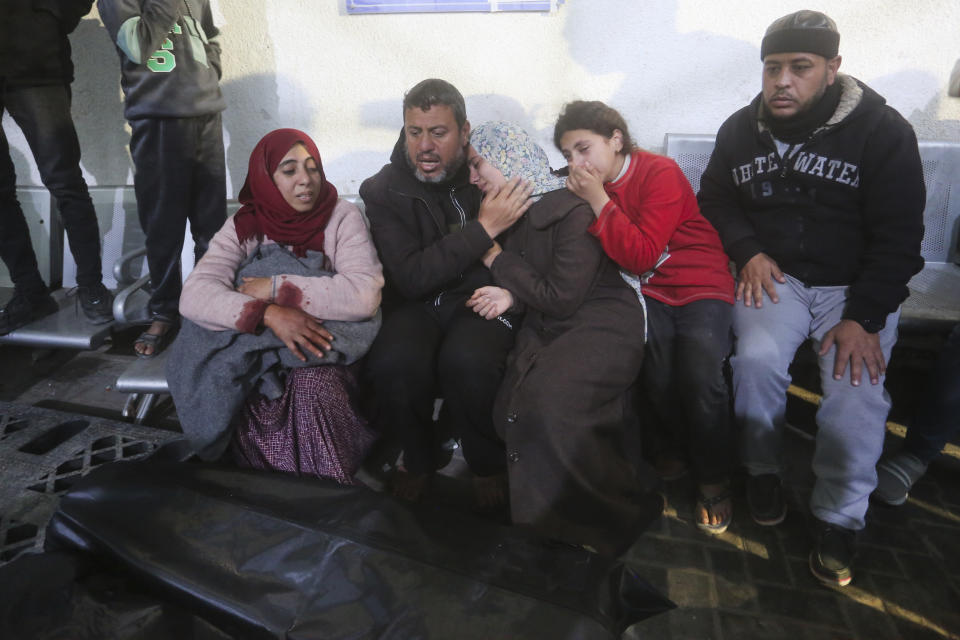 Palestinians mourn relatives killed in Israeli bombardment in Rafah, Gaza Strip, Monday, Feb. 5, 2024. (AP Photo/Hatem Ali)