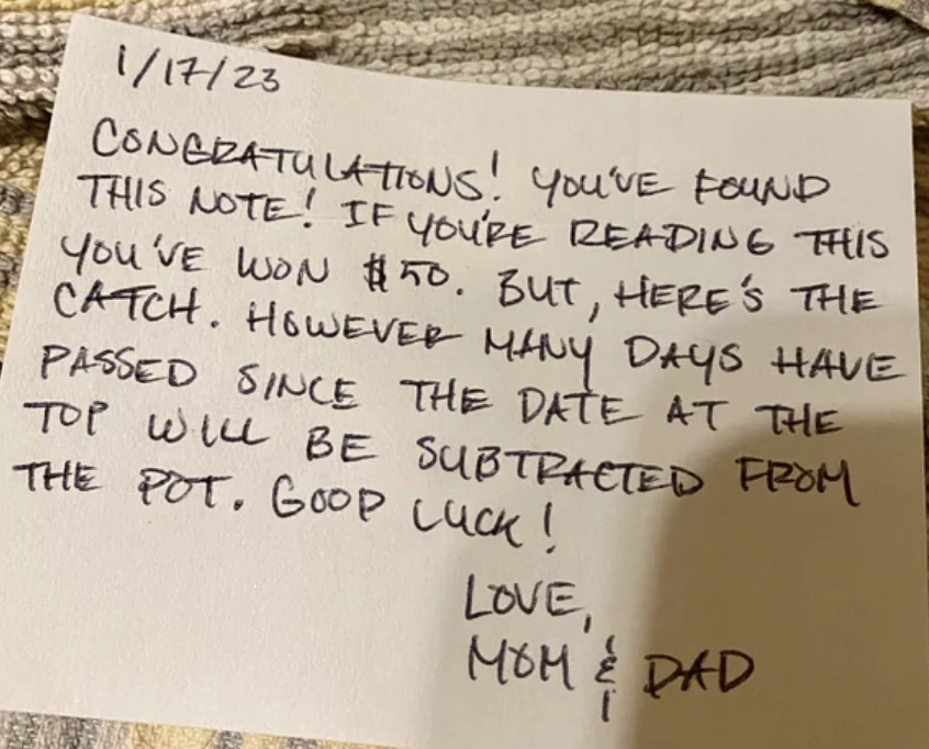 A handwritten note from Mom and Dad dated 1/17 and saying the kids have won $50 for finding it, but the number of days that have passed since that date will be subtracted from the prize