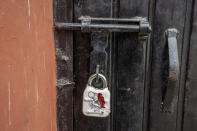 A sealed lock hangs at the gate of the closed Kashmir Press Club building in Srinagar, Indian controlled Kashmir, Tuesday, Jan. 18, 2022. Last week, a few journalists supportive of the Indian government, with assistance from armed police, took control of the region’s only independent press club. Authorities shut it down a day later, drawing sharp criticism from journalist bodies. Reporters Without Borders called it an “undeclared coup” and said the region is “steadily being transformed into a black hole for news and information.” The government defended its move by citing “potential law and order situation” and “the safety of bona fide journalists.” (AP Photo/Dar Yasin)