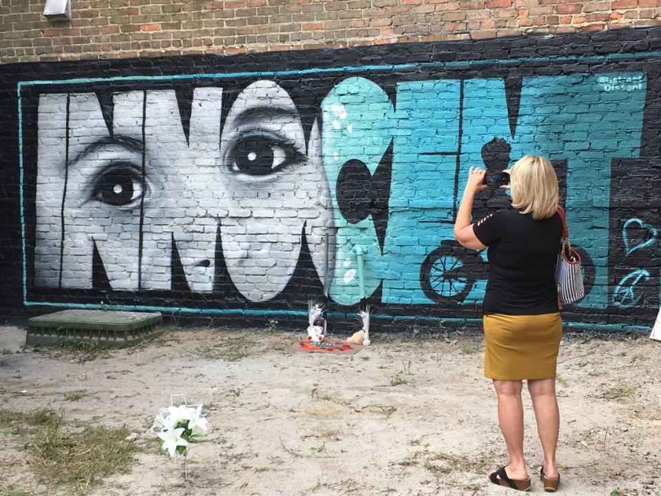 Ruth Godwin visits a mural painted in memory of Cannon Hinnant, a 5-year-old boy from Wilson, shot and killed in his front yard.