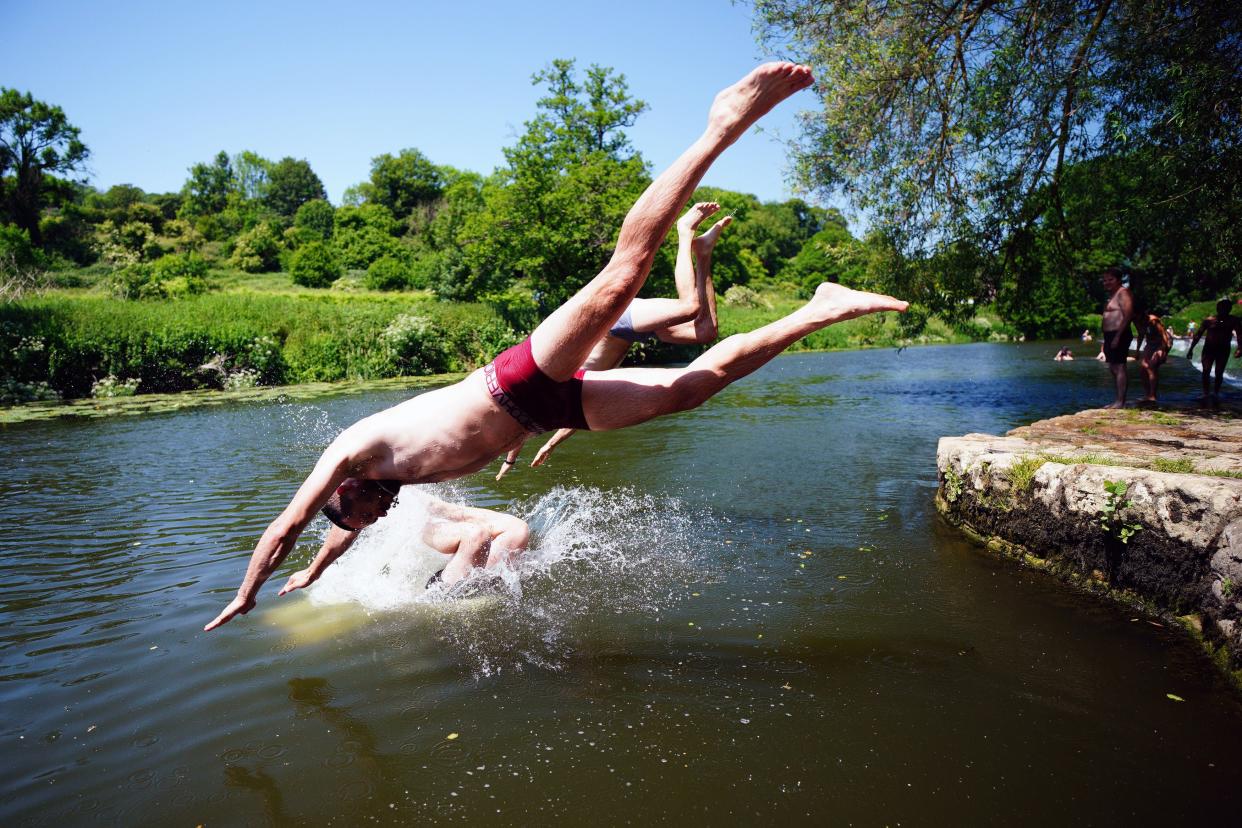 Britons take a dive in hot weather (PA)