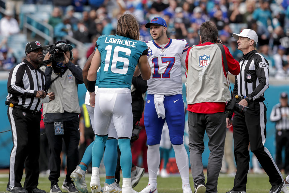 Quarterback Josh Allen #17 shake hands with Quarterback Trevor Lawrence #17 