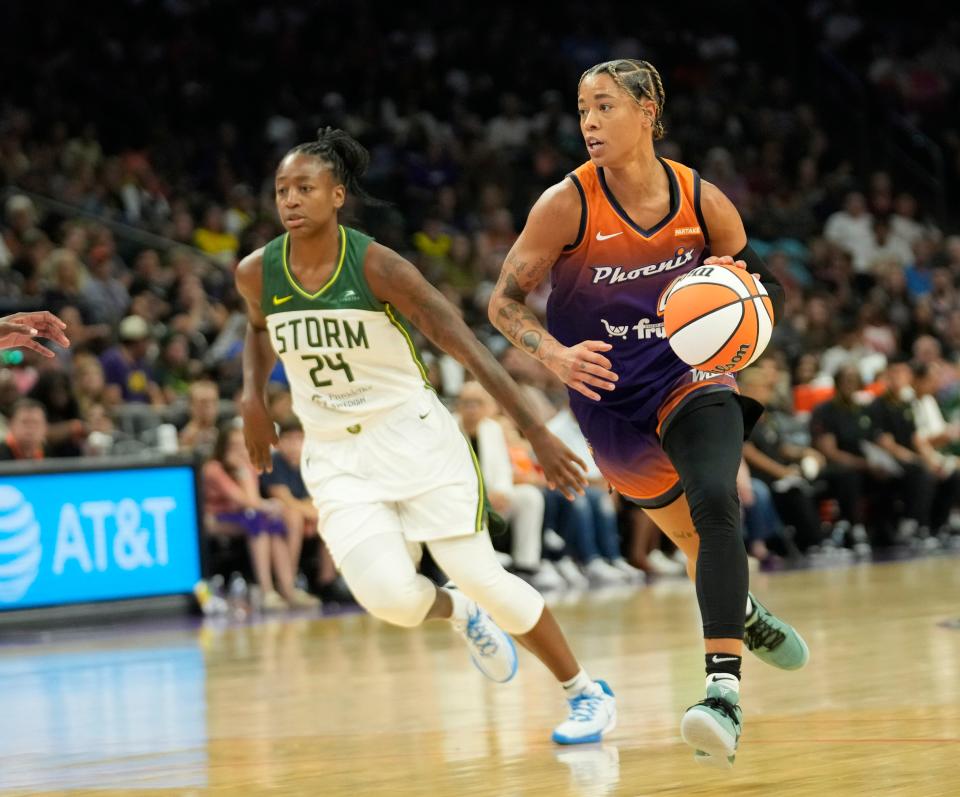 Phoenix Mercury guard Natasha Cloud (0) drives past Seattle Storm guard Jewell Loyd (24) during the third quarter at Footprint Center in Phoenix on Sunday, June 16, 2024.