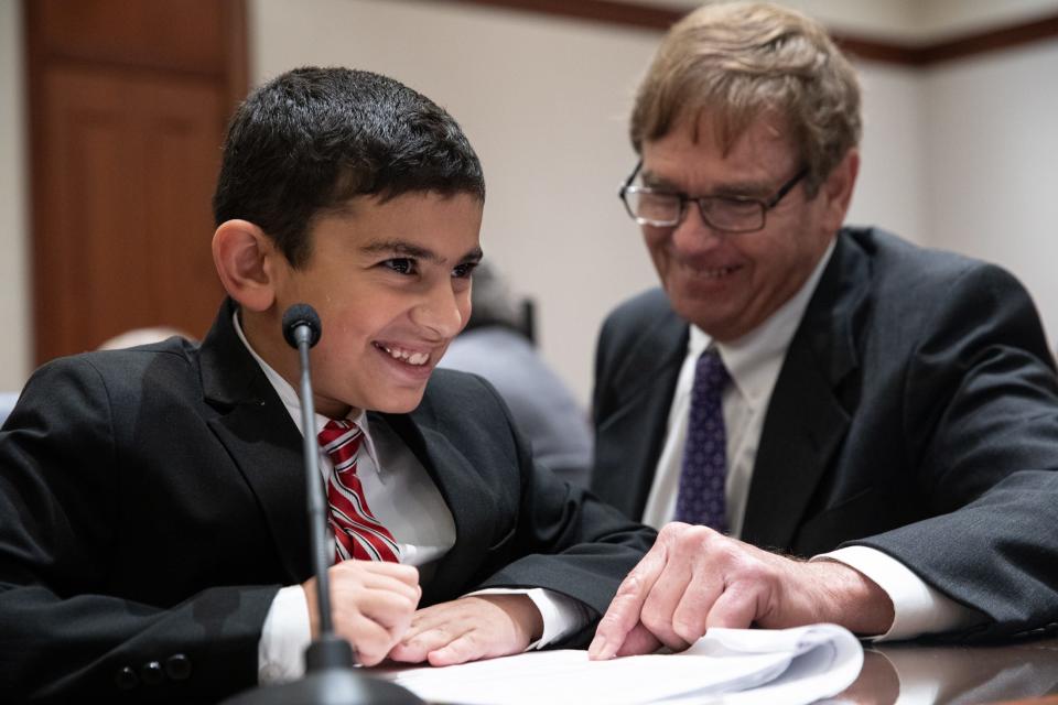 Charlie Webb, assisting the prosecution in The Big Bad Wolf's mock trial, helps Flour Bluff student Erfan Mazloum with his closing argument at the Federal Courthouse on Thursday, Nov. 16, 2023, in Corpus Christi, Texas.