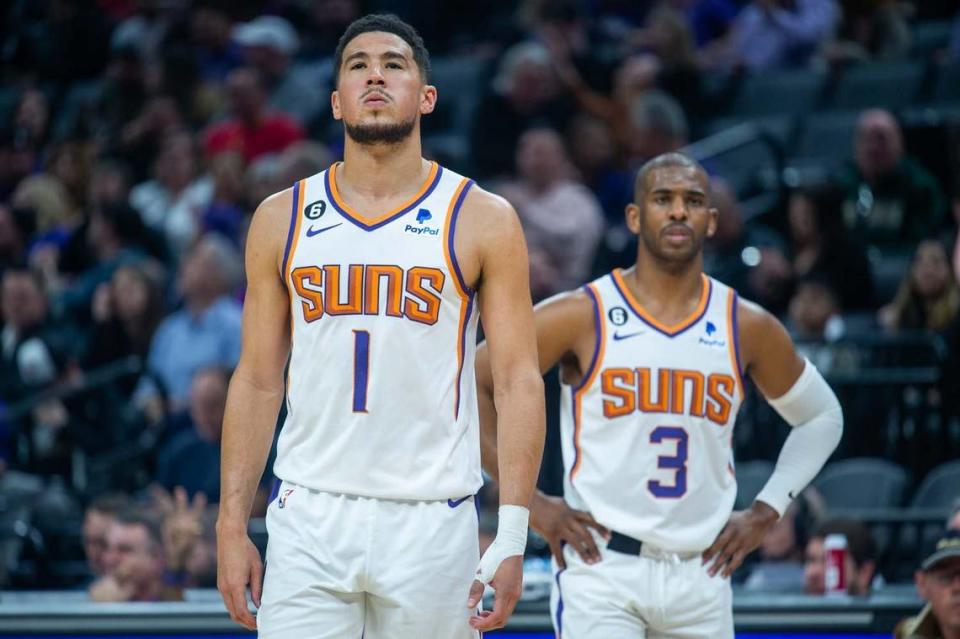 Phoenix Suns guard Devin Booker (1) and teammate Chris Paul (3) during an NBA game between the Sacramento Kings and the Phoenix Suns on Friday, March, 24, 2023 at Golden 1 Center in Sacramento.