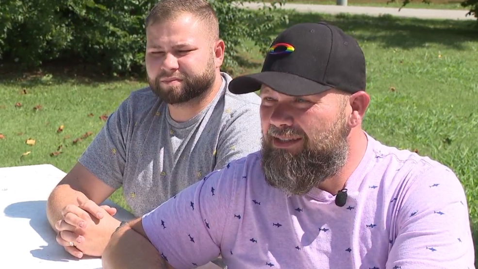 Jessie Goodman, a hairstylist in Tennessee, sits with his fiance Brandon Smitty. (Credit: WTVC)