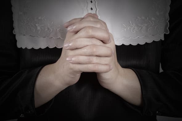 hand of nun praying