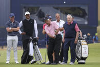 Golf legend Lee Trevino of the United States, chips the ball watched by Northern Ireland's Rory McIlroy, Tiger Woods of the US and Jack Nicklaus, from left, during a 'Champions round' as preparations continue for the British Open golf championship on the Old Course at St. Andrews, Scotland, Monday July 11, 2022. The Open Championship returns to the home of golf on July 14-17, 2022, to celebrate the 150th edition of the sport's oldest championship, which dates to 1860 and was first played at St. Andrews in 1873. (AP Photo/Peter Morrison)