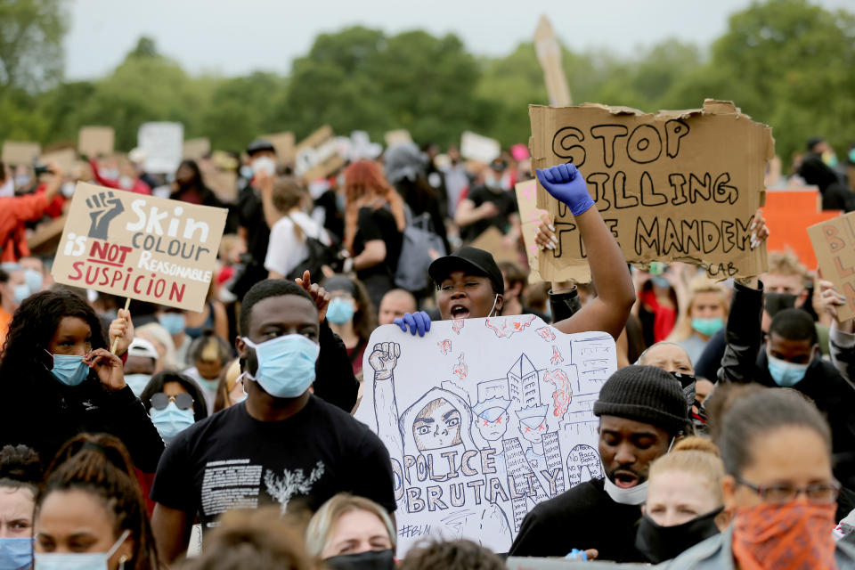 Participants hold placards in a Black Lives Matter protest rally in Hyde Park, London, in memory of George Floyd who was killed on May 25 while in police custody in the US city of Minneapolis. Picture date: Wednesday June 3, 2020. 
