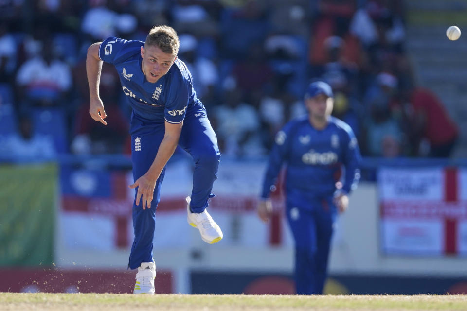 England's Sam Curran bowls against West Indies during the first ODI cricket match at Sir Vivian Richards Stadium in North Sound, Antigua and Barbuda, Sunday, Dec. 3, 2023. (AP Photo/Ricardo Mazalan)