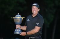 Mar 4, 2018; Mexico City, MEX; Phil Mickelson poses with the winner's trophy following the final round of the WGC - Mexico Championship golf tournament at Club de Golf Chapultepec. Orlando Ramirez-USA TODAY Sports