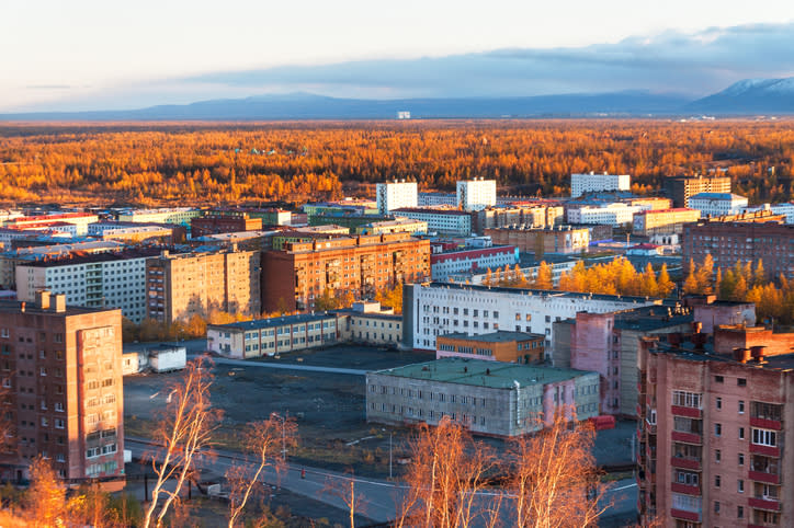 The residential area of the industrial city in the Arctic Circle. Sunset.