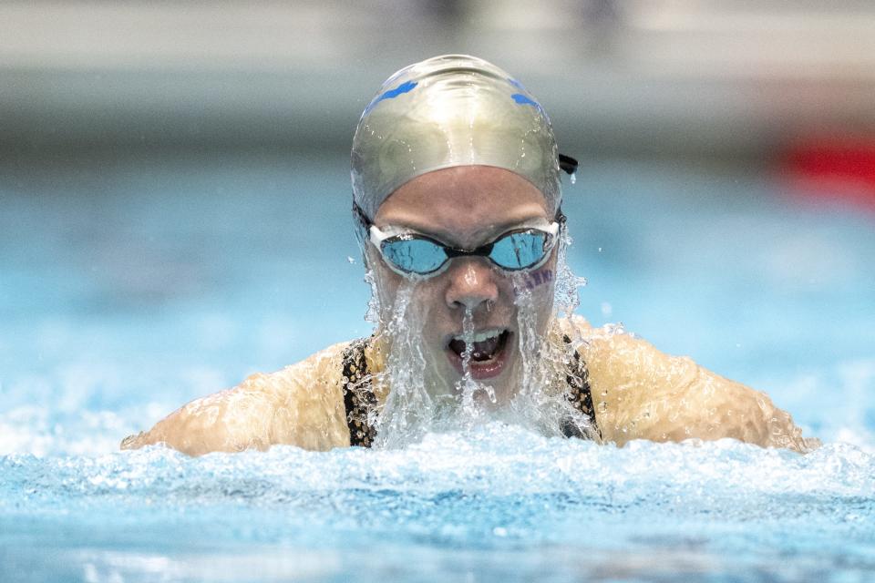 Carmel High School freshman Molly Sweeney competes in the Girls 100 Yard Breaststroke during an IHSAA Girlsâ€™ Swimming state championship, Saturday, Feb. 11, 2023, at IU Natatorium in Indianapolis.