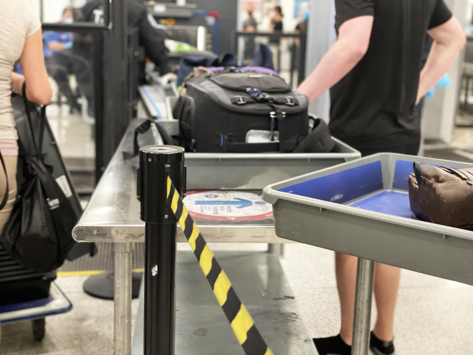 luggage going through security line