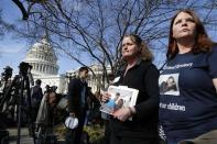 Family members of victims of the GM recall failure arrive to hold a news conference on the U.S. Capitol grounds in Washington April 1, 2014. REUTERS/Jonathan Ernst