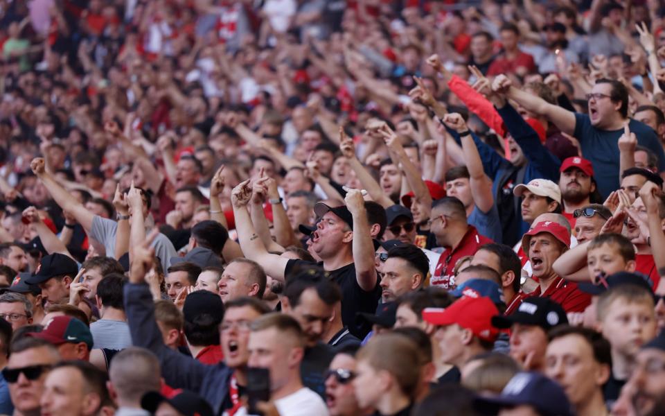 Liverpool fans make their feelings clear during the playing of the national anthem at Wembley - EPA